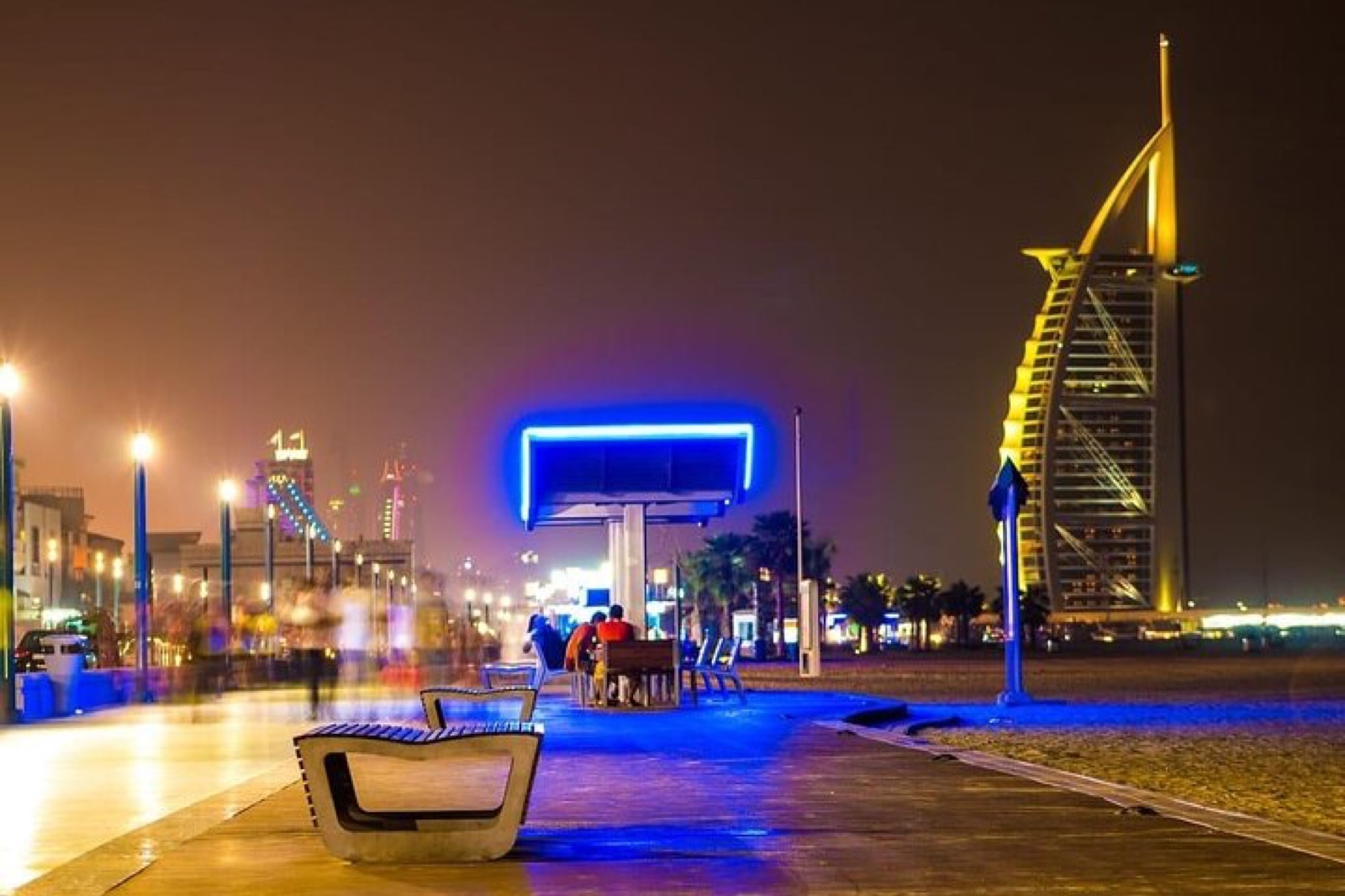 Jumeirah beach walk with Burj Al Arab lit at night
